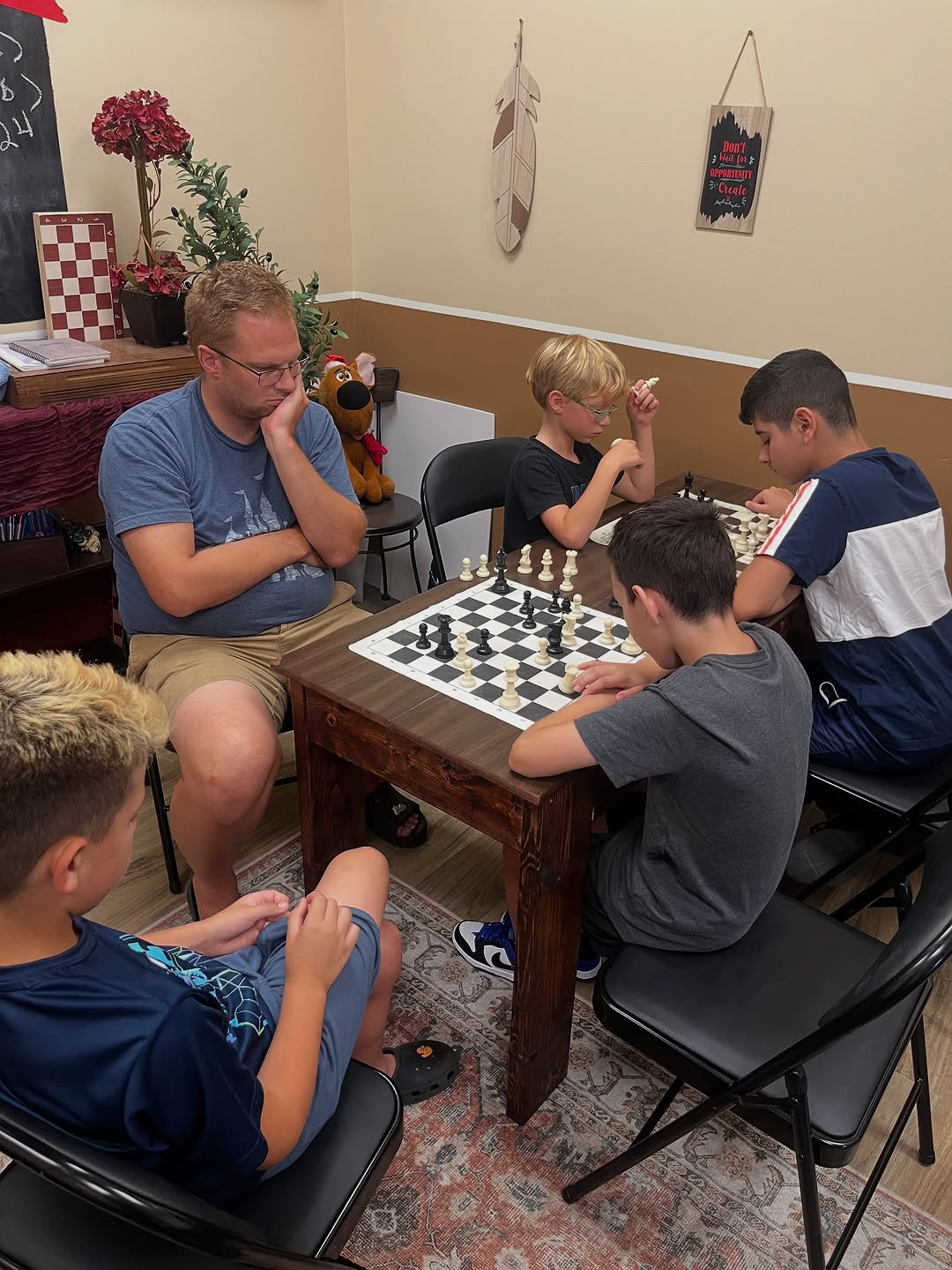 A group of chess students smiling